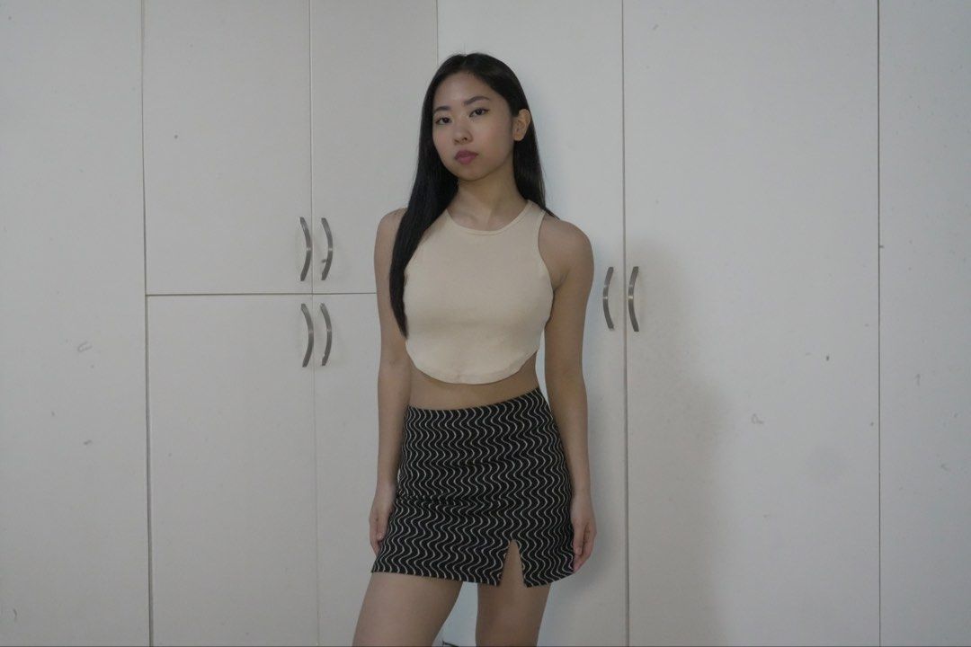 Bershka sleeveless crop top + PULL&BEAR mini skirt (Category: Sleeveless) located in Manila. Submitted by danse.ph (Listing ID 1470308590, Image 2). Description: TOP: worn: several times brand: BERSHKA size: M -beige high-neck, sleeveless, ribbed racerback crop top featuring a curved hem line SKIRT: worn: several times brand: PULL&BEAR size: S -black-and-white wavy-patterned mini skirt.