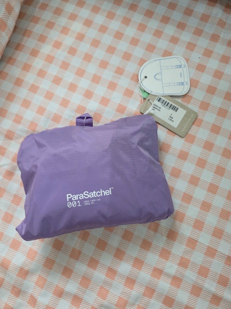 Beyond The Vines ParaSatchel 001 Lavender Backpack (Category: Backpacks) located in Antipolo. Submitted by pinkpandascloset (Listing ID 1470257980, Image 1). Description: - Brand: Beyond The Vines - Model: ParaSatchel 001 - Color: Lavender - Condition: needs wash - Material: Lightweight ripstop nylon (290g) - Capacity: 12L - Dimensions: H40.5 x W34 x D5 cm - Features: Front vertical zipper pocket, top handle, adjustable shoulder straps, and brand