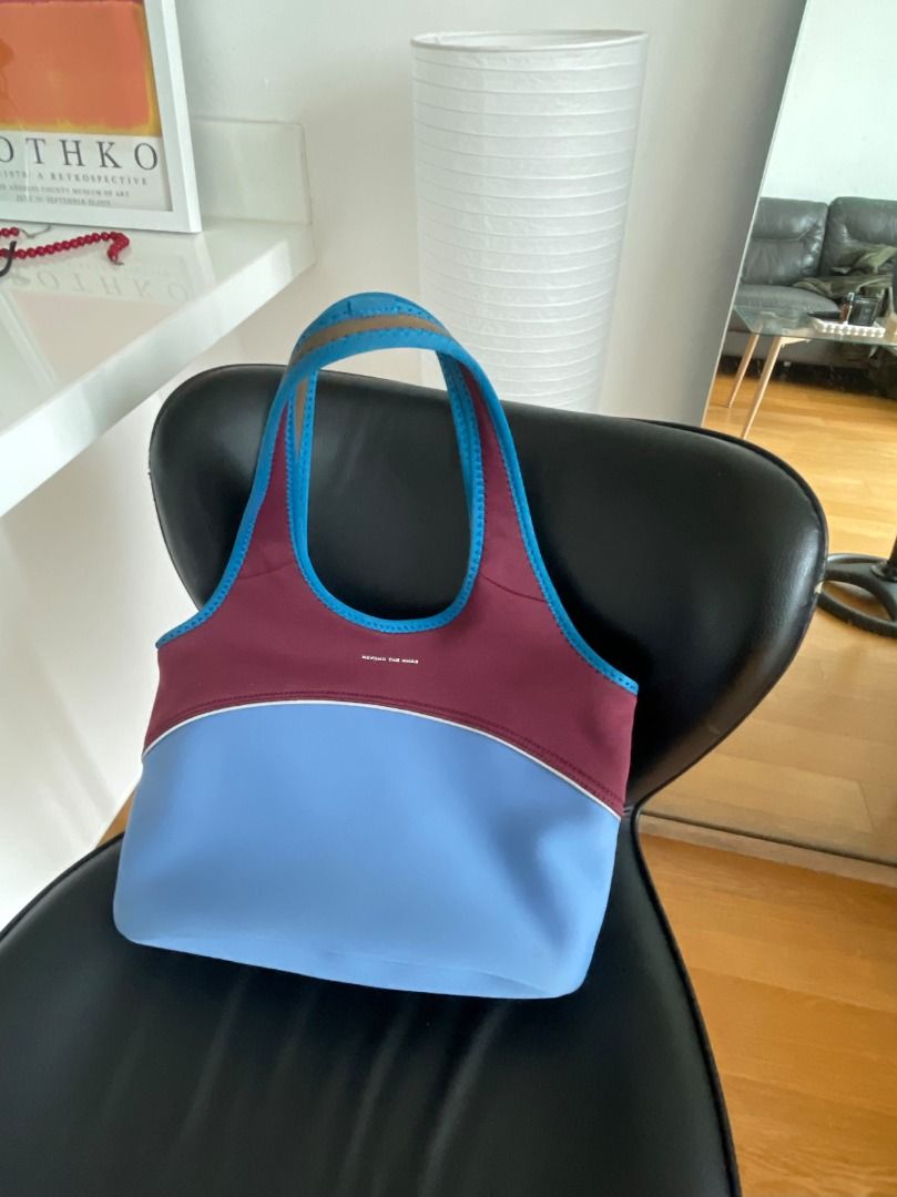 Beyond The Vines Tote Bag (Category: Tote Bags) located in Pasig City. Submitted by mimosaaas (Listing ID 1470197465, Image 1). Description: - Brand: Beyond The Vines - Design: Chic colorblock in light blue, dark red, and bright blue trim with white front logo - Material: Lightweight, stretchy, and durable neoprene - Features: Dual top carry handles and a roomy main compartment for all your daily essentials Used only for a month. No receipt. Stil