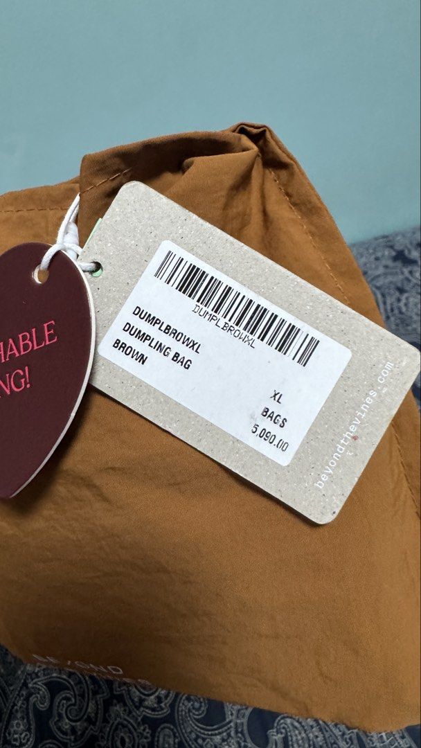 Beyond The Vines XL Dumpling Bag - Brown (Category: Cross-body Bags) located in Quezon City. Submitted by proudrn (Listing ID 1470288181, Image 3). Description: Used once/twice With tags With spot dirt markings but washable (baka napatakan ng iced tea, ganun 🥺) kaya selling low nalang din.. No major issue/flaw or damage RFS: decluttering - too many bags.. 🥺 kaya hindi nagagamit...