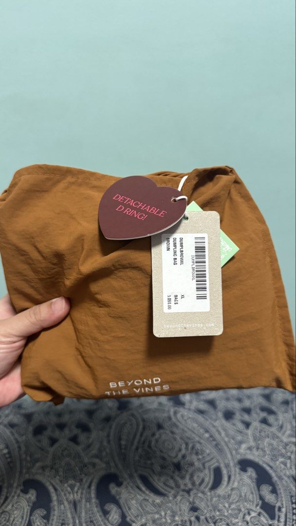Beyond The Vines XL Dumpling Bag - Brown (Category: Cross-body Bags) located in Quezon City. Submitted by proudrn (Listing ID 1470288181, Image 2). Description: Used once/twice With tags With spot dirt markings but washable (baka napatakan ng iced tea, ganun 🥺) kaya selling low nalang din.. No major issue/flaw or damage RFS: decluttering - too many bags.. 🥺 kaya hindi nagagamit...