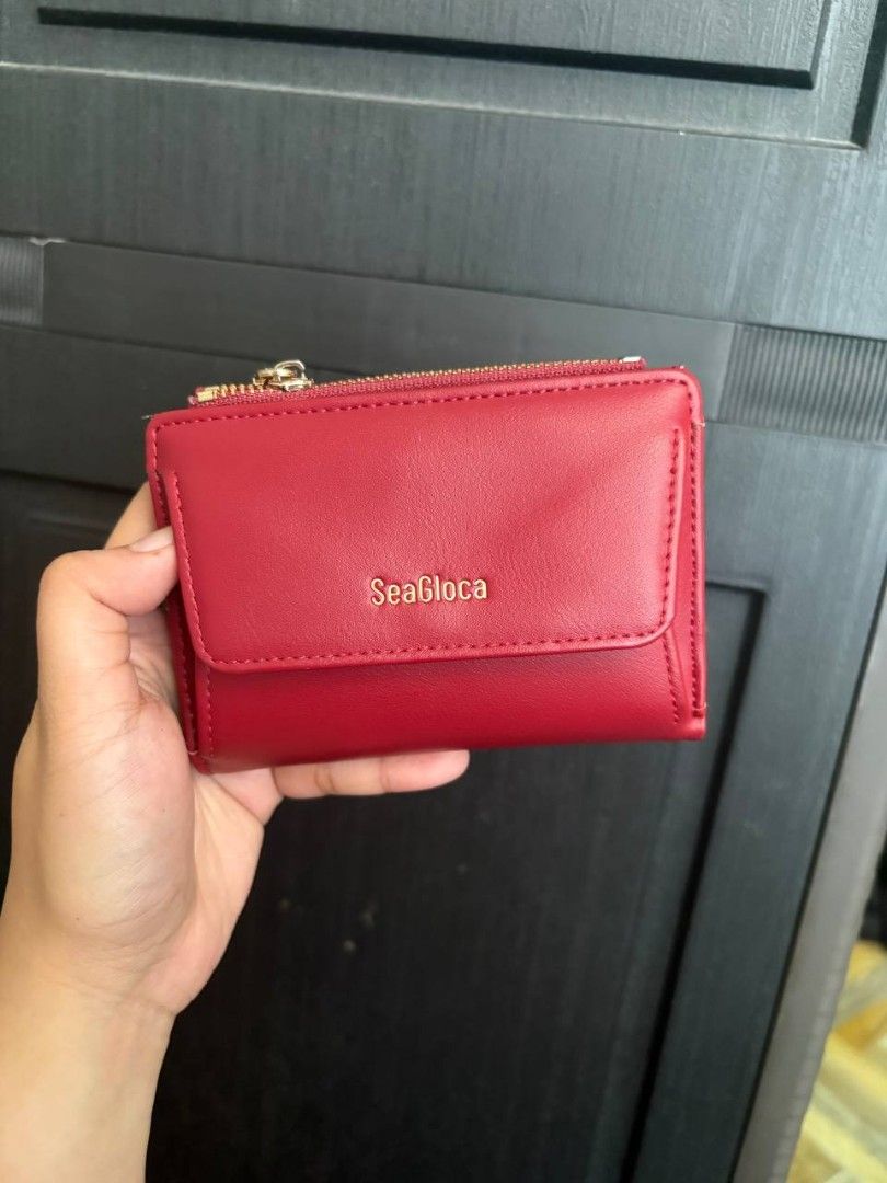 Bifold Red Wallet (Category: Wallets & Card holders) located in Pasay City. Submitted by celinenotdionx (Listing ID 1470209716, Image 1). Description: cute red bifold wallet. brought from T. decluttering. shipping: lalamove/j&t.