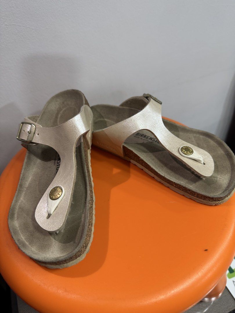 Birkenstock Gizeh Metallic Silver Sandals Size 32 (Category: Babies & Kids Fashion) located in Valenzuela. Submitted by sofiasticated.decluttering (Listing ID 1470157069, Image 2). Description: - Brand: Birkenstock - Model: Gizeh - Color: Metallic Silver - Size: 32 - Style: Thong sandal with adjustable metal buckle strap - Features: Contoured cork footbed with signature branding - Origin: Made in Germany - Condition: Pre-owned with visible wear o