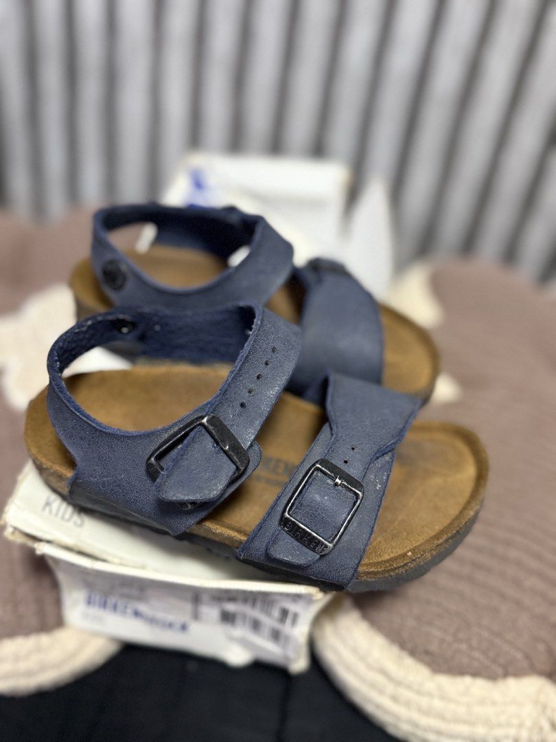 Birkenstock Kids Sandals Blue (Category: Babies & Kids Fashion) located in Manila. Submitted by eyprilalba81287 (Listing ID 1470174420, Image 2). Description: - Brand: Birkenstock - Color: Blue - Size: Kids - Features: Two adjustable top straps and a heel strap for a secure fit - Comfort: Classic supportive cork footbed and textured rubber outsole - Condition/Inclusions: Great for everyday wear and outdoor activities, comes with original shoe box