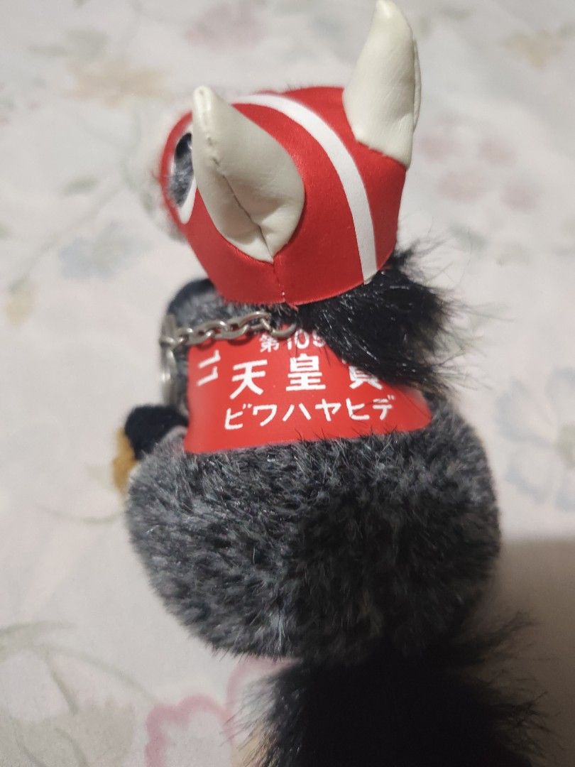 Biwa Hayahide Small Plush Keychain (Category: Plushies & Soft Toys) located in Manila. Submitted by jbsantos_ (Listing ID 1470327918, Image 2). Description: - Character: Biwa Hayahide (Uma Musume Pretty Derby) - Type: Small plush toy keychain - Details: Red racing hood, matching saddle blanket with Japanese text, grey/black fuzzy body with white face markings - Hardware: Metal chain attached at the side - Condition: No paper tag included, well-ke