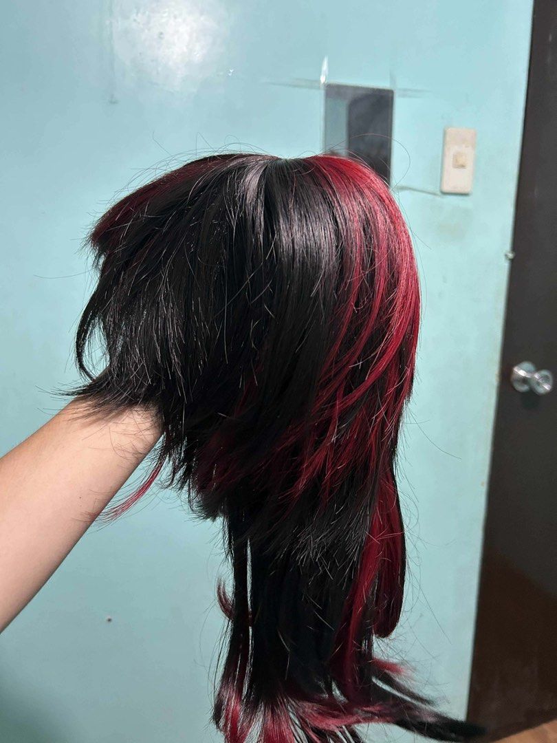 Black and Red Highlights Layered Wig (Category: Hair Accessories) located in Manila. Submitted by lovely.453 (Listing ID 1470234320, Image 1). Description: - Style: Layered medium-to-long wig with feathered ends - Color: Black base with vibrant red streaks - Material: High-quality synthetic fiber - Interior: Clean cap for comfortable wear - Versatile: Great for everyday styling, parties, and cosplay events - Condition: Ready to wear.