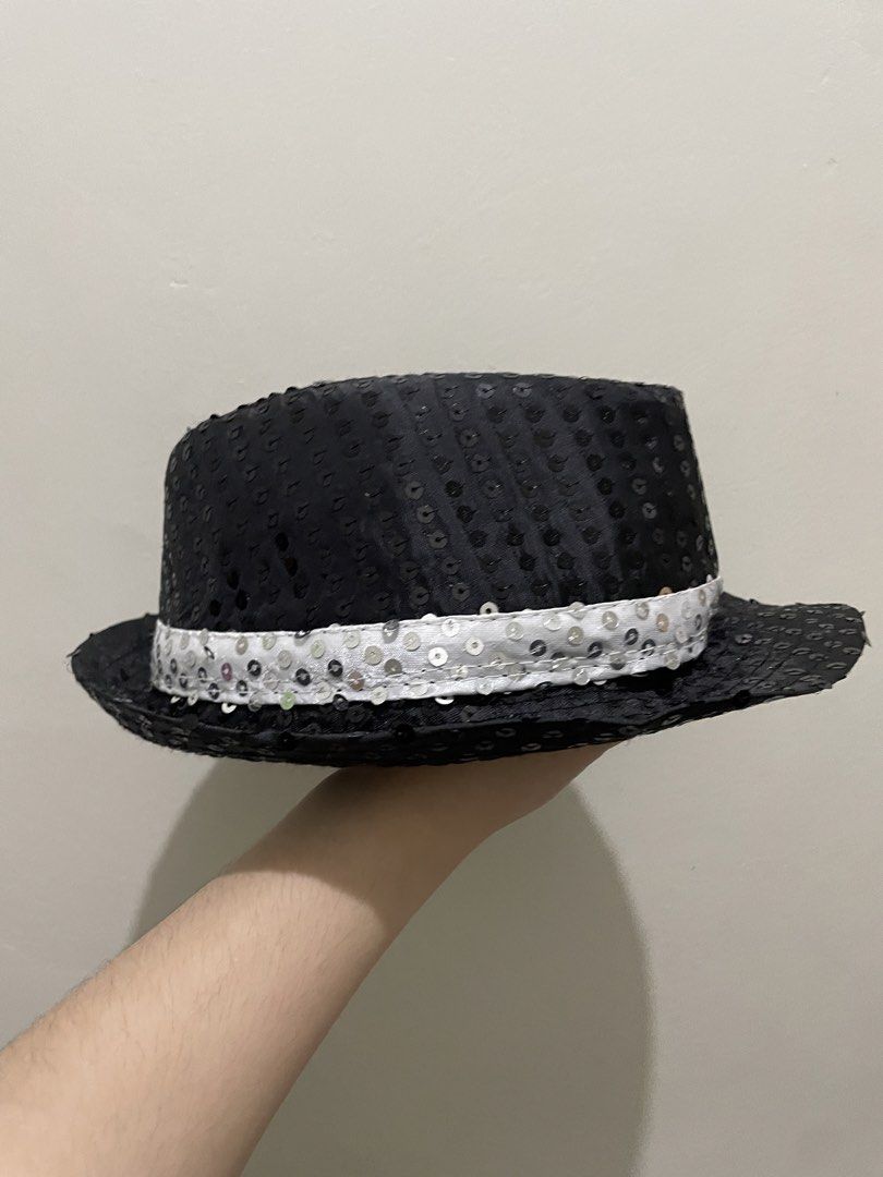 Black and Silver Sequined Fedoras Hat (Category: Babies & Kids Fashion) located in Guiguinto. Submitted by beatan13 (Listing ID 1470320676, Image 2). Description: - Eye-catching black fedora fully covered in shiny sequins - Features a stylish white sequined band around the base - Lightweight and comfortable design for all-night wear - Standard adult sizing - Ideal for costume parties, dance performances, and stage events.
