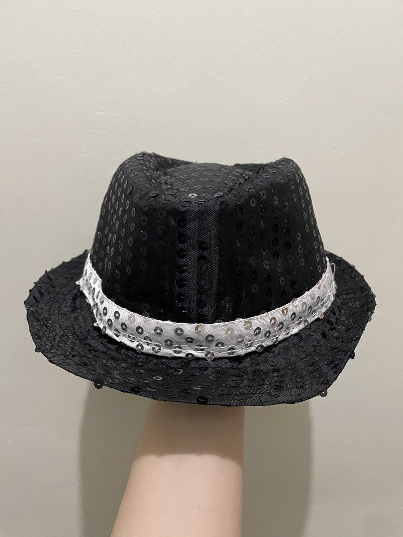 Black and Silver Sequined Fedoras Hat (Category: Babies & Kids Fashion) located in Guiguinto. Submitted by beatan13 (Listing ID 1470320676, Image 3). Description: - Eye-catching black fedora fully covered in shiny sequins - Features a stylish white sequined band around the base - Lightweight and comfortable design for all-night wear - Standard adult sizing - Ideal for costume parties, dance performances, and stage events.