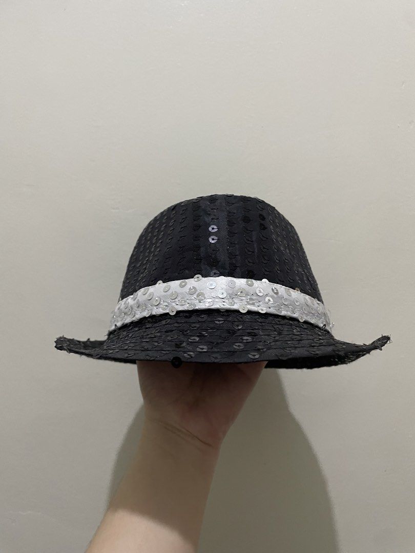 Black and Silver Sequined Fedoras Hat (Category: Babies & Kids Fashion) located in Guiguinto. Submitted by beatan13 (Listing ID 1470320676, Image 1). Description: - Eye-catching black fedora fully covered in shiny sequins - Features a stylish white sequined band around the base - Lightweight and comfortable design for all-night wear - Standard adult sizing - Ideal for costume parties, dance performances, and stage events.