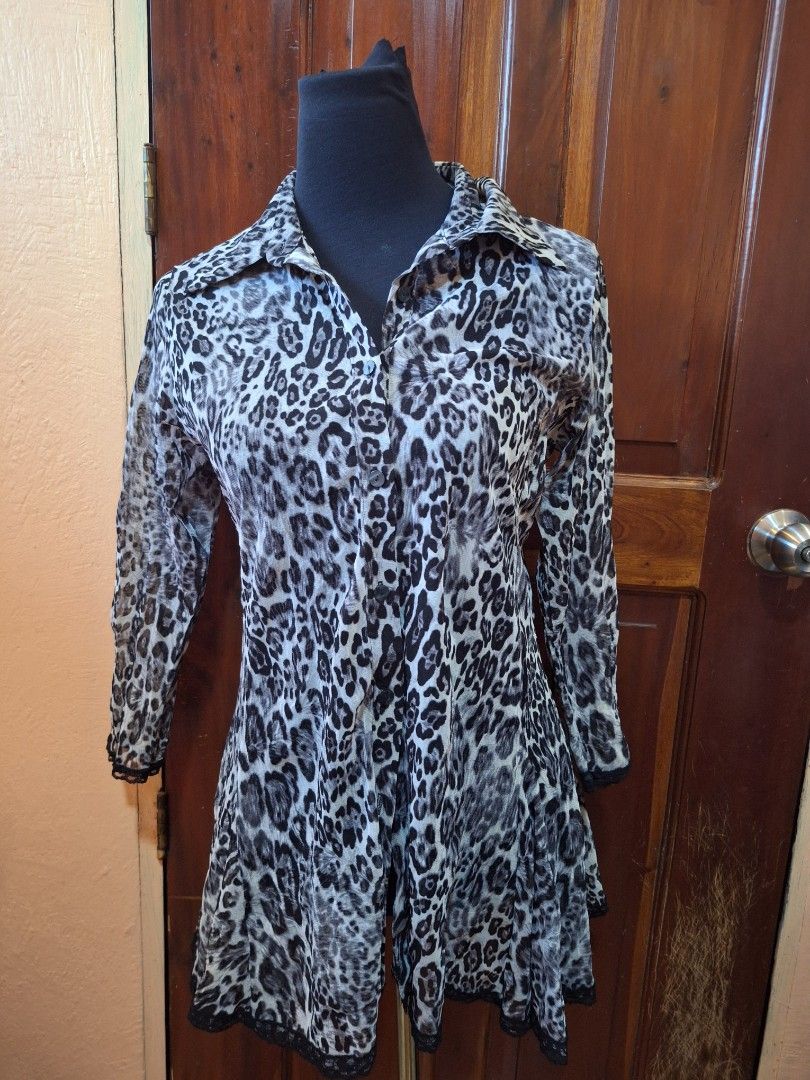 Black and white leopard print long sleeve blouse (Category: Longsleeves) located in Balamban. Submitted by ubethan (Listing ID 1470213023, Image 1). Description: - Style: Button-down blouse with classic collar - Pattern: Trendy black and white leopard print - Sleeves: Long sleeves - Fabric: Lightweight and slightly sheer patterned material - Fit: Regular fit with a flattering, nice drape - Condition: Excellent / Ready to wear.