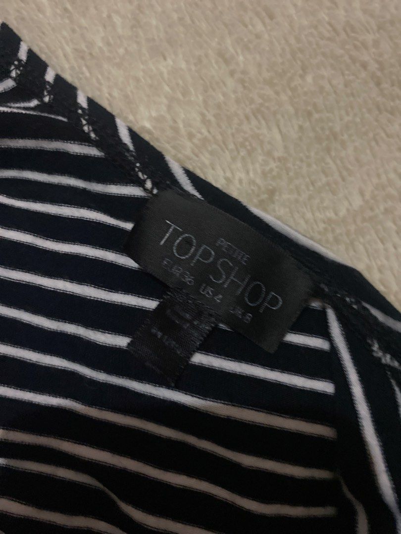 Black and White Striped Bodysuit with Lace-up Front (Category: Blouses) located in Alaminos. Submitted by chichiyr (Listing ID 1470172042, Image 3). Description: NEGOTIABLE PO YUNG PRICE!! Dm for inquiries - Classic black and white striped design - Deep V-neck with adjustable lace-up chest tie - Sleeveless with comfortable wide straps - Convenient bottom snaps closure - Super stretchy and comfortable fabric - Versatile basic top for jeans or skir
