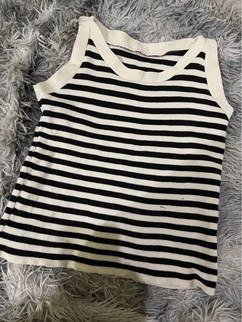 Black and White Striped Ribbed Tank Top (Category: Sleeveless) located in Manila. Submitted by zhahanna (Listing ID 1470228739, Image 1). Description: - Style: Black & white striped ribbed tank top - Fit: Snug and stretchy knit fabric - Mode of Payment: GCash - Shipping: Via J&T Express (Buyer shoulders shipping fee).