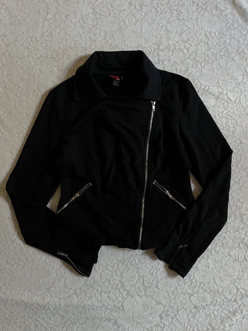 Black Biker Jacket Moto Asymmetrical Zip Size M (Category: Coats, Jackets and Outerwear) located in Baguio. Submitted by dutefinds (Listing ID 1470347579, Image 1). Description: - Color: Solid black - Size: Medium - Material: Comfortable cotton or cotton-blend - Design: Asymmetrical front zipper with a collared neckline and structured fit - Details: Silver hardware, diagonal front pockets, and zippered cuffs - Style: Versatile and easy to match w