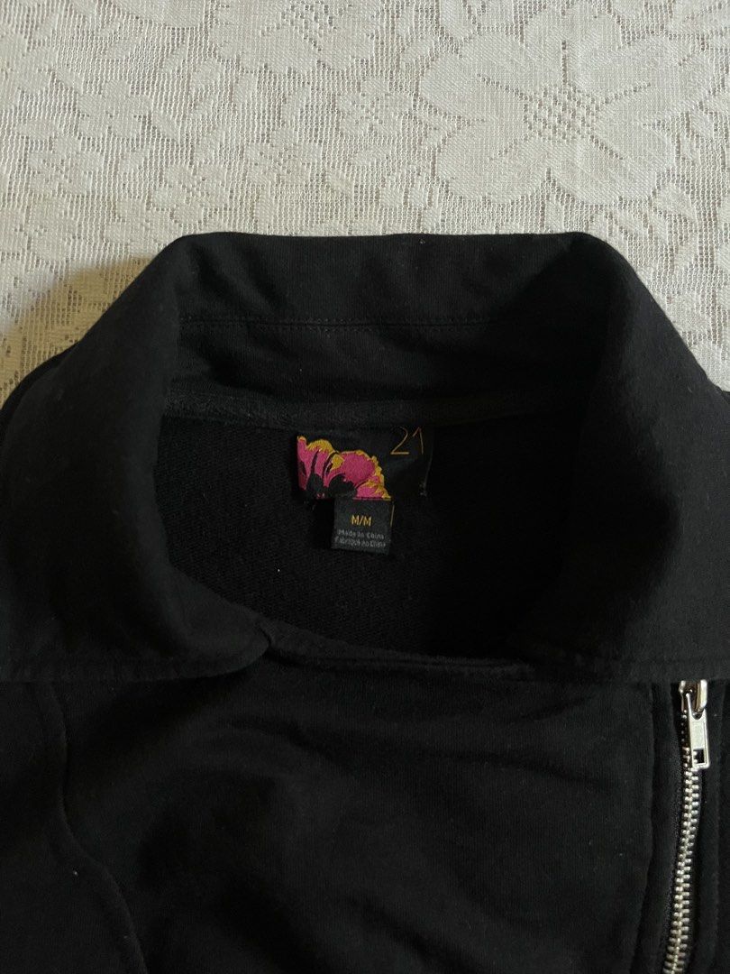 Black Biker Jacket Moto Asymmetrical Zip Size M (Category: Coats, Jackets and Outerwear) located in Baguio. Submitted by dutefinds (Listing ID 1470347579, Image 2). Description: - Color: Solid black - Size: Medium - Material: Comfortable cotton or cotton-blend - Design: Asymmetrical front zipper with a collared neckline and structured fit - Details: Silver hardware, diagonal front pockets, and zippered cuffs - Style: Versatile and easy to match w