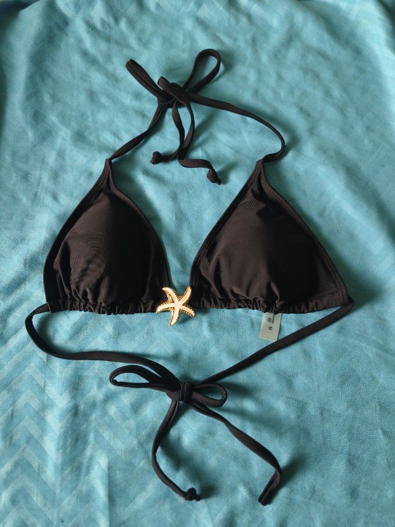 Black Bikini Set and 1 Free Bikini Bottom (Category: Bikinis & Swimsuits) located in Legazpi City. Submitted by maryyy08 (Listing ID 1470168141, Image 1). Description: - Size: XS-M - Color: Bikini Black Set and Blue Violet Bikini Bottom - Style: Halter neck with standard triangle cut - Details: Features a decorative gold and white starfish charm between the cups - Fit: Adjustable ties at the neck and back - Condition: Never used, thrifted as prel