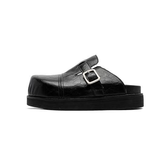 Black Chunky Buckle Clogs Platform Mules (Category: Flats & Sandals) located in Cabuyao City. Submitted by 0ld_souls (Listing ID 1470219207, Image 1). Description: - Style: Slip-on platform mule clogs - Toe: Modern square toe design - Closure: Single strap with a chic silver-tone metal buckle - Sole: Thick rubber sole for height and durability - Material: Smooth faux leather upper - Color: Classic black (easy to pair with any outfit!).