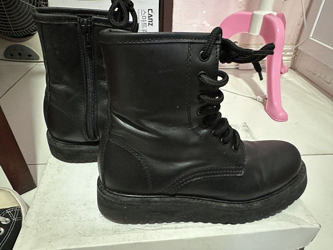 Black Combat Boots with Side Zipper and Platform Sole (Category: Boots) located in Dasmarinas. Submitted by maecybee (Listing ID 1470181800, Image 1). Description: - Style: Classic ankle-high black combat boots - Sole: Chunky platform with sturdy grip - Closure: Lace-up front and convenient side zipper for easy on/off - Material: Synthetic leather with normal wear around creases - Condition: Good, soles still have plenty of life left.