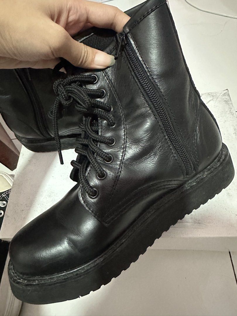 Black Combat Boots with Side Zipper and Platform Sole (Category: Boots) located in Dasmarinas. Submitted by maecybee (Listing ID 1470181800, Image 2). Description: - Style: Classic ankle-high black combat boots - Sole: Chunky platform with sturdy grip - Closure: Lace-up front and convenient side zipper for easy on/off - Material: Synthetic leather with normal wear around creases - Condition: Good, soles still have plenty of life left.