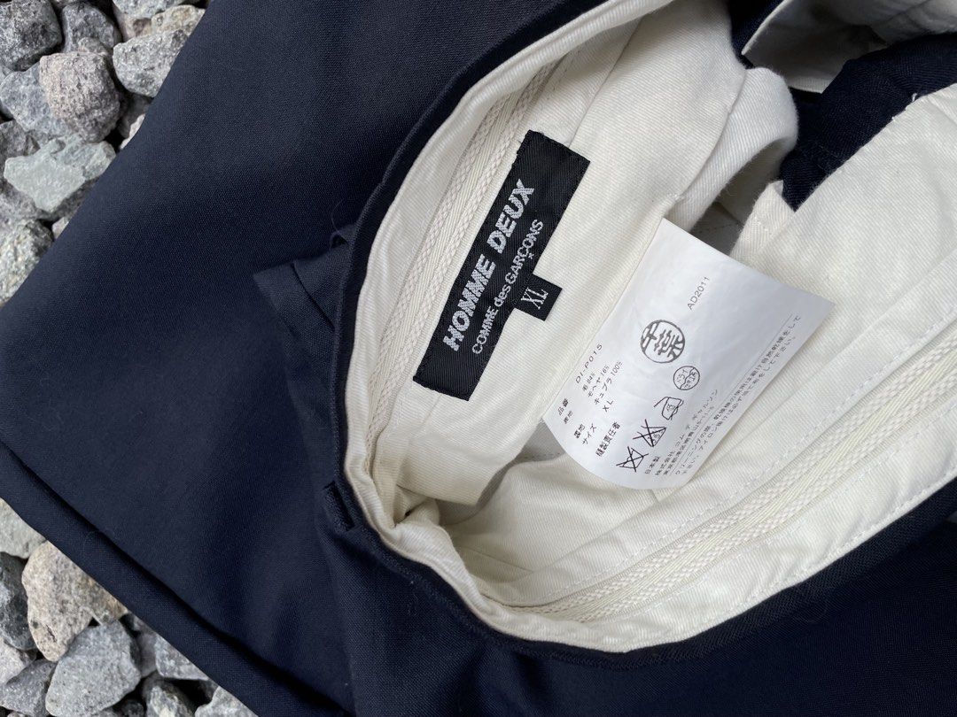 black cuffed hem buttoned back pocket belt loops concealed fastening (Category: Luxury Apparel) located in Davao. Submitted by lwky_thrift (Listing ID 1470333449, Image 3). Description: Comme des Garçons Homme Deux cuffed trousers Authentic Size: XL 185/100A Excellent Condition Details: black cuffed hem buttoned back pocket belt loops concealed fastening.