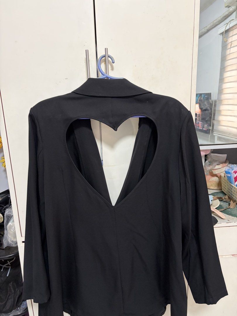 Black Double Breasted Blazer with Cut Out Heart Back (Category: Coats, Jackets and Outerwear) located in Pateros City. Submitted by selleysells (Listing ID 1470240951, Image 2). Description: - Style: Black double-breasted blazer with notched lapels and long sleeves - Unique Design: Cutout heart with crossing straps on the back - Material: Smooth, high-quality fabric - Occasion: Ideal for going out, parties, or special events - Condition: Excellen