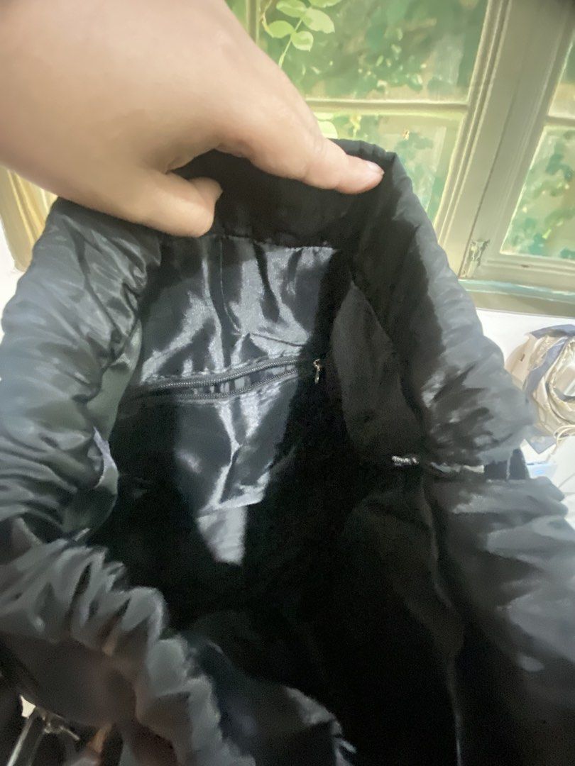 Black Drawstring Backpack with White Stripes (Category: Backpacks) located in Makati City. Submitted by declutter_saleeeee (Listing ID 1470247253, Image 3). Description: Rfs: not being used No issues, just needs cleaning.