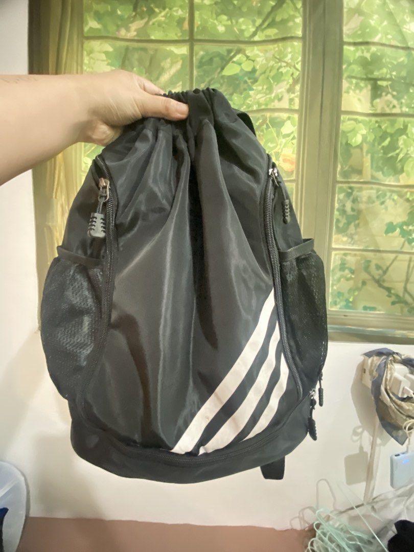 Black Drawstring Backpack with White Stripes (Category: Backpacks) located in Makati City. Submitted by declutter_saleeeee (Listing ID 1470247253, Image 1). Description: Rfs: not being used No issues, just needs cleaning.