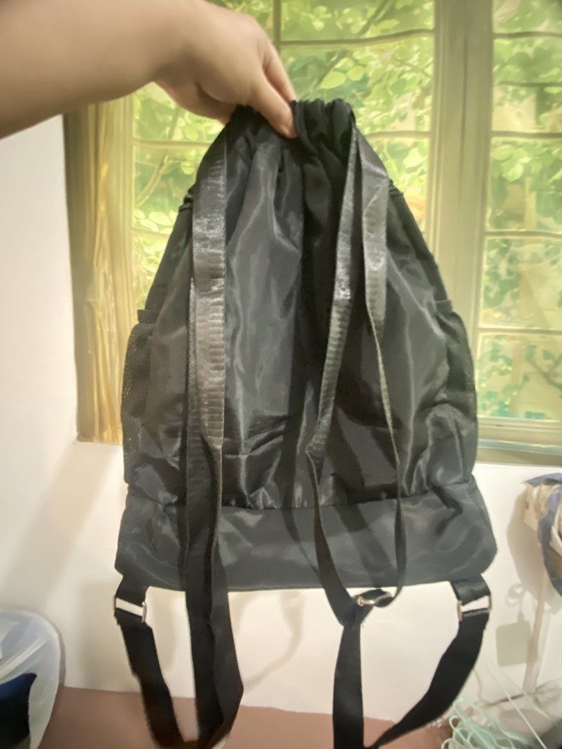 Black Drawstring Backpack with White Stripes (Category: Backpacks) located in Makati City. Submitted by declutter_saleeeee (Listing ID 1470247253, Image 2). Description: Rfs: not being used No issues, just needs cleaning.