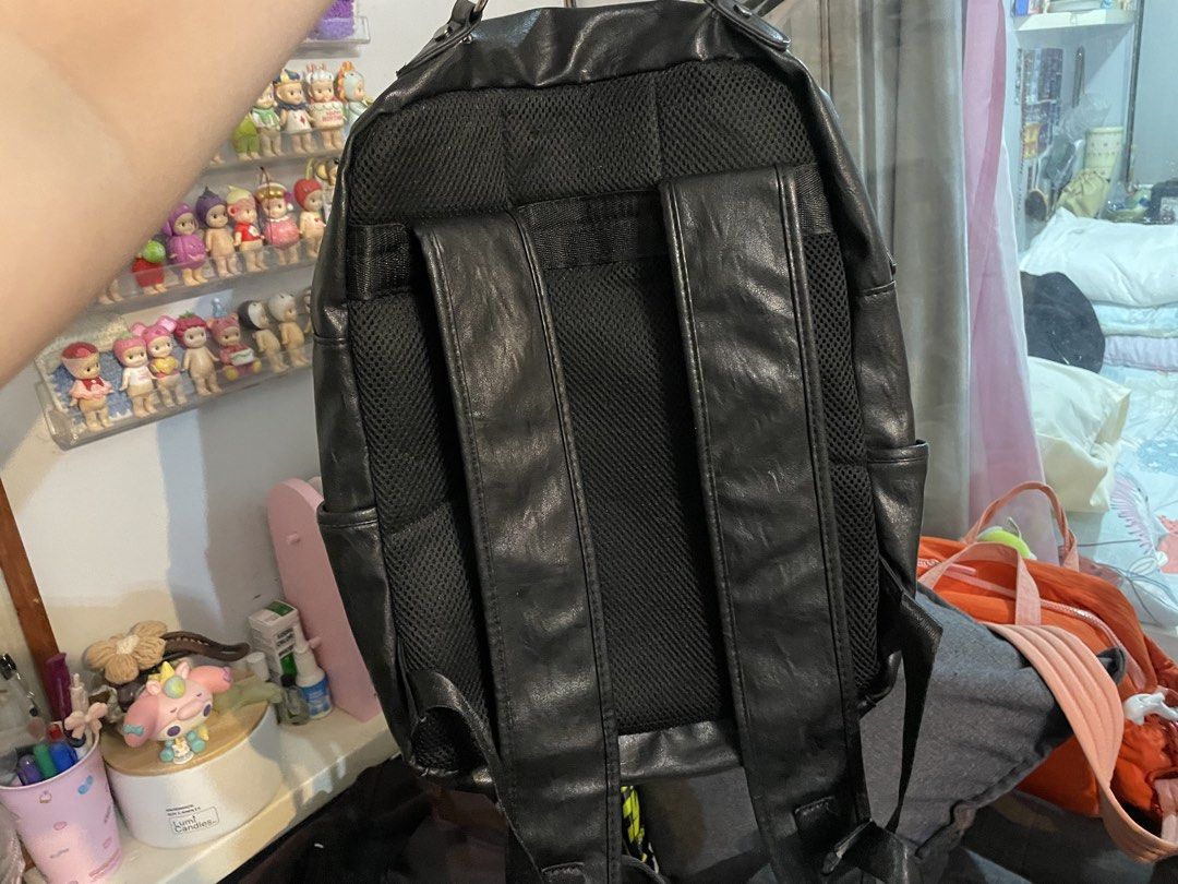 Black faux leather backpack with multiple zipper pockets (Category: Backpacks) located in Pasig City. Submitted by raeraesold333 (Listing ID 1470305540, Image 2). Description: - Material: Premium black faux leather - Storage: Multiple compartments including a vertical zip pocket, horizontal zip compartment, and wide-opening main section - Laptop Friendly: Includes a secure, padded laptop sleeve with strap closure - Extra Storage: Convenient inner