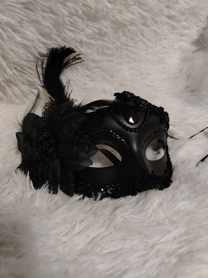 Black Feathered Masquerade Mask (Category: Occasions & Party Supplies) located in Cavite. Submitted by yrlclothing (Listing ID 1470306473, Image 1). Description: - Elegant black masquerade mask - Intricate detailing with embellishments and feathers - Perfect for parties, events, or costume use - Sleek design and comfortable fit - Stylish accessory to complete any outfit.