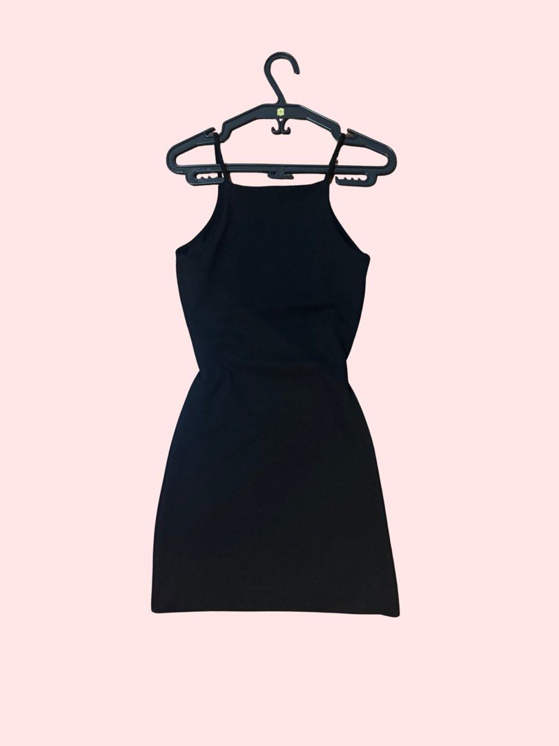 Black Halter Neck Mini Dress (Category: Dresses) located in Pasig City. Submitted by kia.sell (Listing ID 1470296483, Image 2). Description: - Brand: Mango / MNG (100% Authentic) - Style: Sleeveless bodycon halter / high-square-neck mini dress - Color: Classic Black - Fabric: Soft stretch rib-knit blend (hugs the body comfortably) - Condition: Excellent pre-loved condition, well-maintained with no flaws - Size: S-M - Has been slightly altered at 