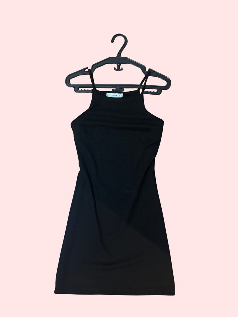 Black Halter Neck Mini Dress (Category: Dresses) located in Pasig City. Submitted by kia.sell (Listing ID 1470296483, Image 1). Description: - Brand: Mango / MNG (100% Authentic) - Style: Sleeveless bodycon halter / high-square-neck mini dress - Color: Classic Black - Fabric: Soft stretch rib-knit blend (hugs the body comfortably) - Condition: Excellent pre-loved condition, well-maintained with no flaws - Size: S-M - Has been slightly altered at 