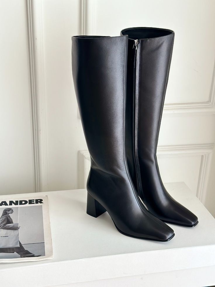 Black Knee-High Boots with Block Heel (Category: Boots) located in Malinao. Submitted by xycalla30 (Listing ID 1470154974, Image 1). Description: - Color: Sleek black - Toe Design: Modern square toe - Heel: Comfortable chunky block heel for all-day wear - Closure: Convenient side zip - Finish: Smooth matte - Styling: Perfect to pair with skirts or skinny jeans.