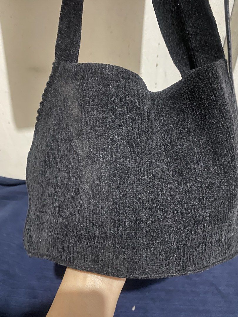 Black Knitted Shoulder Bag Tote (Category: Shoulder Bags) located in Manila. Submitted by resi.diaz (Listing ID 1470321407, Image 2). Description: - Color: Classic Black - Design: Simple, unstructured, and slouchy fit - Strap: Single wide strap for comfortable carrying - Storage: Deep main compartment for all your daily essentials - Condition: Like new with tag attached inside lining, clean with no tears or stains.