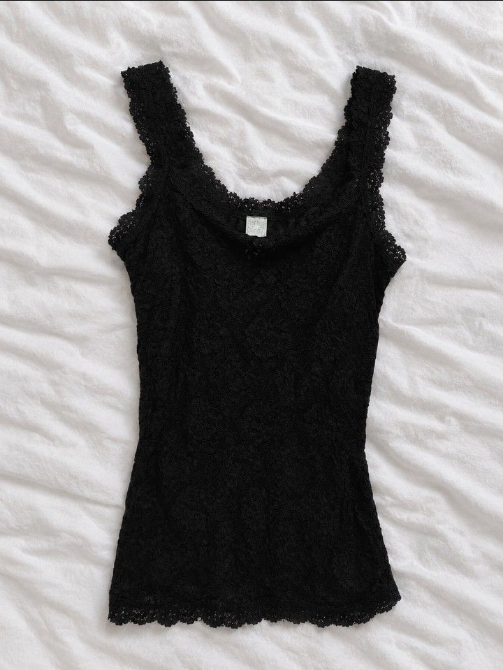 Black Lace Cami Tank Top💕🪽 (Category: Sleeveless) located in Manila. Submitted by itgirl.archive (Listing ID 1470227589, Image 1). Description: - xs to s💕🪽 - Color: Black - Material: Lightweight stretch lace fabric - Design: All-over floral lace pattern with wide lace straps - Details: Scalloped edges on neckline and hem - Styling: Perfect for layering or wearing on its own - Condition: Like new.