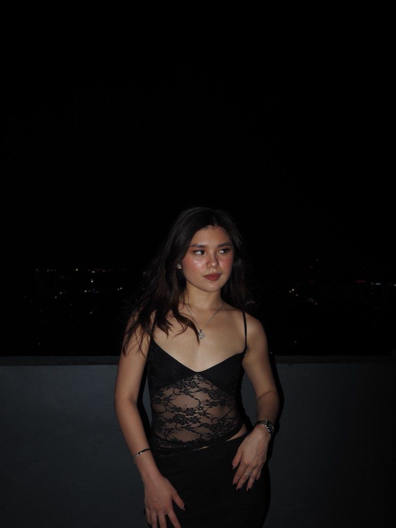 Black lace camisole sleeveless top (Category: Sleeveless) located in Marikina City. Submitted by maybe.ellie (Listing ID 1470277822, Image 1). Description: - Color: Black - Design: Sheer floral lace bodice with a solid black lower section - Straps: Delicate spaghetti straps - Fit: Fitted silhouette, lightweight material - Styling: Versatile piece for casual day wear or night outs.