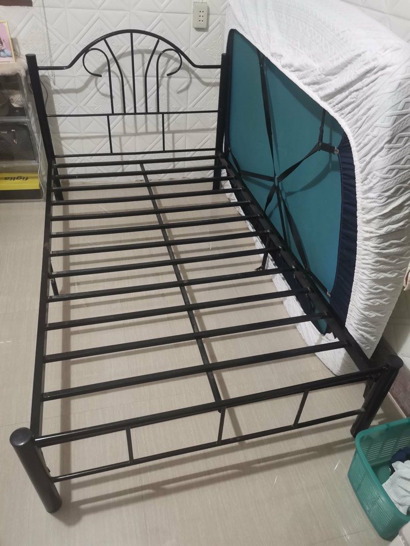 Black Metal Bed Frame With Slats (Category: Bed Frames & Mattresses) located in Manila. Submitted by emkay2117 (Listing ID 1470196735, Image 3). Description: - Sturdy black metal bed frame with classic scrollwork headboard - Built-in metal slats provide solid mattress support without needing a box spring - Durable construction designed to hold up well over time - Easy to assemble - Fits most standard single or double size mattresses - Budget-frie