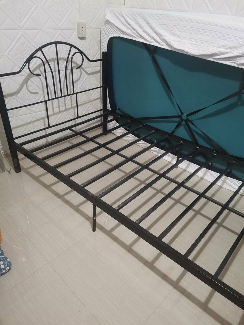 Black Metal Bed Frame With Slats (Category: Bed Frames & Mattresses) located in Manila. Submitted by emkay2117 (Listing ID 1470196735, Image 1). Description: - Sturdy black metal bed frame with classic scrollwork headboard - Built-in metal slats provide solid mattress support without needing a box spring - Durable construction designed to hold up well over time - Easy to assemble - Fits most standard single or double size mattresses - Budget-frie