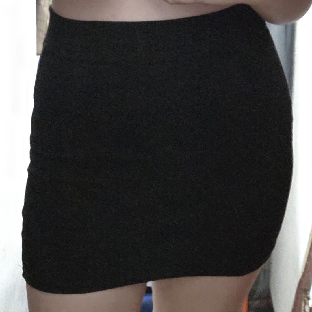 thrifted black mini skirt (Category: Skirts) located in Mandaluyong City. Submitted by raekartz (Listing ID 1470302497, Image 1). Description: - love this skirt sm kaso don't have any tops to partner this with and i don't know how to style this 😅 - no inner shorts size: s (w - 25 in, l - 14 in) condition: thrifted + like new issue (?): unsure if intentional but hem of the skirt isn't straight (see pics) rfs: need funds dm for inquiries! mop: gca