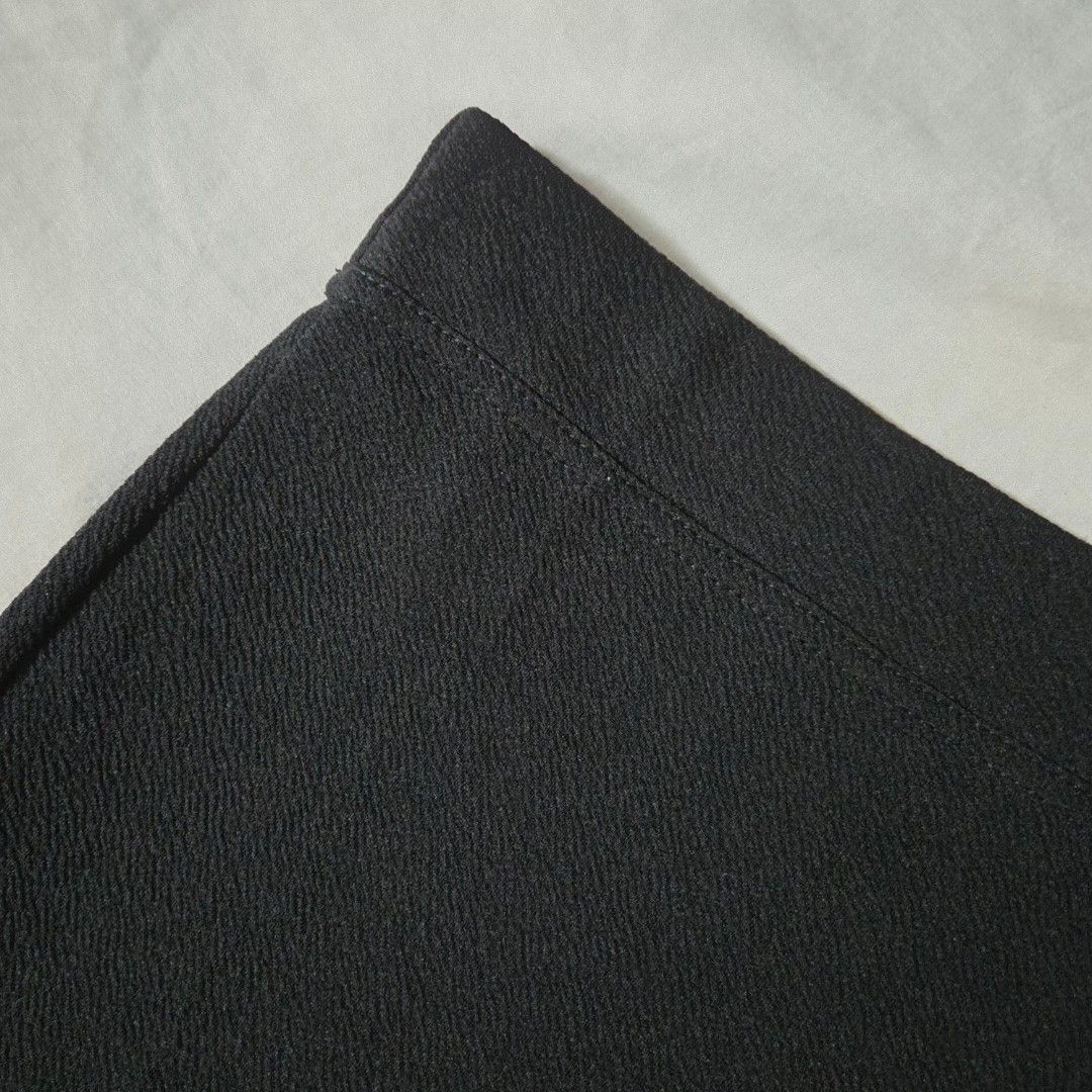 thrifted black mini skirt (Category: Skirts) located in Mandaluyong City. Submitted by raekartz (Listing ID 1470302497, Image 3). Description: - love this skirt sm kaso don't have any tops to partner this with and i don't know how to style this 😅 - no inner shorts size: s (w - 25 in, l - 14 in) condition: thrifted + like new issue (?): unsure if intentional but hem of the skirt isn't straight (see pics) rfs: need funds dm for inquiries! mop: gca