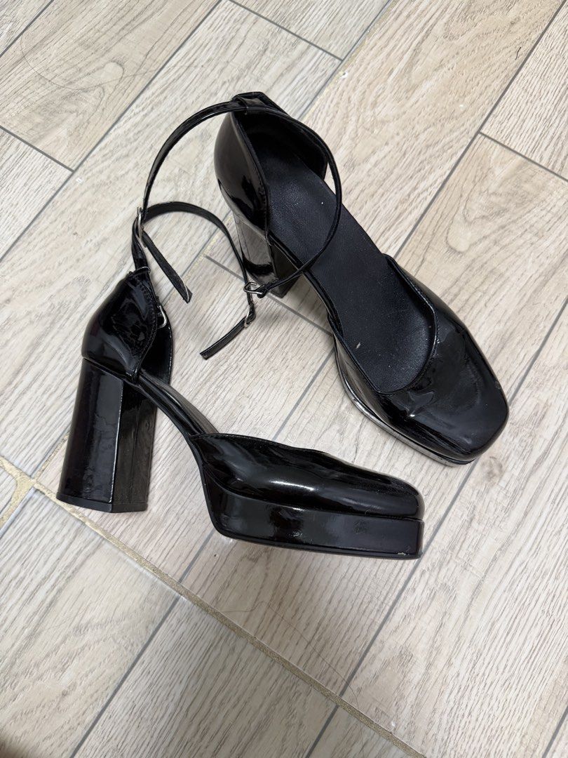 Black Patent Platform Block Heels Ankle Strap Size 38 (Category: Heels) located in Rizal. Submitted by kianapreloves (Listing ID 1470256530, Image 1). Description: - Color & Finish: Black patent - Style: Square toe with chunky block heel and platform sole - Closure: Ankle strap with metal buckle - Size: 38 (marked on sole) - Comfort Feature: Extra cushioned insert inside the left shoe - Condition: Some scuffs and scratches on the platform surface