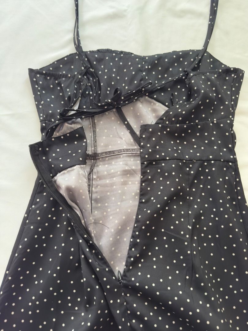 Black Polka Dot Slip Midi Dress with Front Split Small (Category: Dresses) located in Cebu City. Submitted by _t.rix (Listing ID 1470198889, Image 3). Description: - Color & Pattern: Classic black with small white polka dots - Design: Spaghetti straps, ruched bust detail, and fitted bodice - Features: Sexy high front slit, trendy back cutout with tie closure, and concealed lower back zipper - Comfort: Lightweight fabric with full inner lining - C