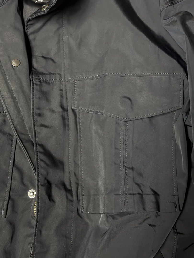 Black Polyester Utility Jacket Size M (Category: Coats, Jackets and Outerwear) located in Manila. Submitted by seangoart (Listing ID 1470308778, Image 2). Description: - Color: Black - Size: Medium - Material: 100% Polyester (Shell and Lining) - Closure: Zip closure with front snap buttons - Pockets: Multiple front flap pockets for ample storage - Design: High stand-up collar - Origin: Made in China - Condition: Brand new with tags.