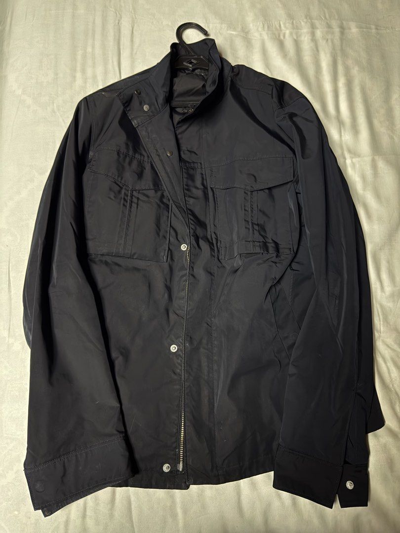 Black Polyester Utility Jacket Size M (Category: Coats, Jackets and Outerwear) located in Manila. Submitted by seangoart (Listing ID 1470308778, Image 1). Description: - Color: Black - Size: Medium - Material: 100% Polyester (Shell and Lining) - Closure: Zip closure with front snap buttons - Pockets: Multiple front flap pockets for ample storage - Design: High stand-up collar - Origin: Made in China - Condition: Brand new with tags.