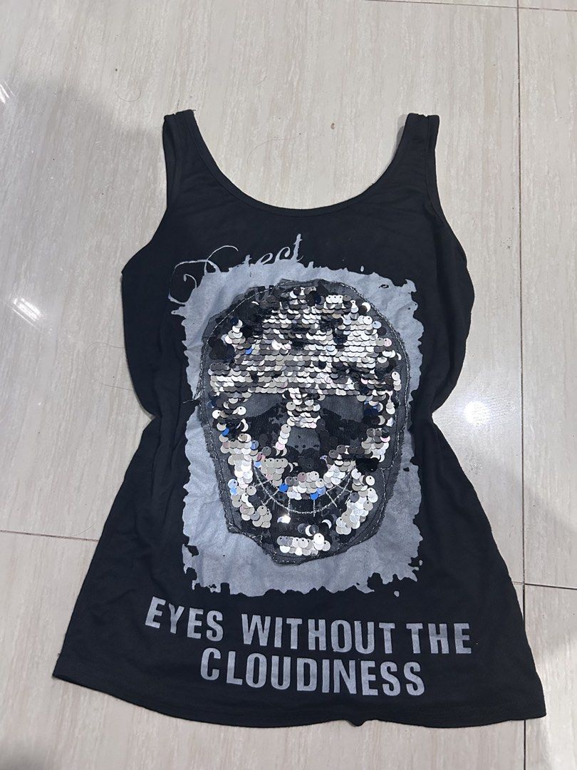 Black Skull Sequin beaded Graphic Tank Top (Category: Sleeveless) located in Manila. Submitted by lovely.453 (Listing ID 1470283267, Image 1). Description: - Color: Black - Style: Sleeveless tank top with a classic scoop neck - Design: Eye-catching large skull graphic made of silver and black sequins on the front - Detailing: Silver front text reads 'EYES WITHOUT THE CLOUDINESS' and back features distressed white text printing - Material: Soft, l