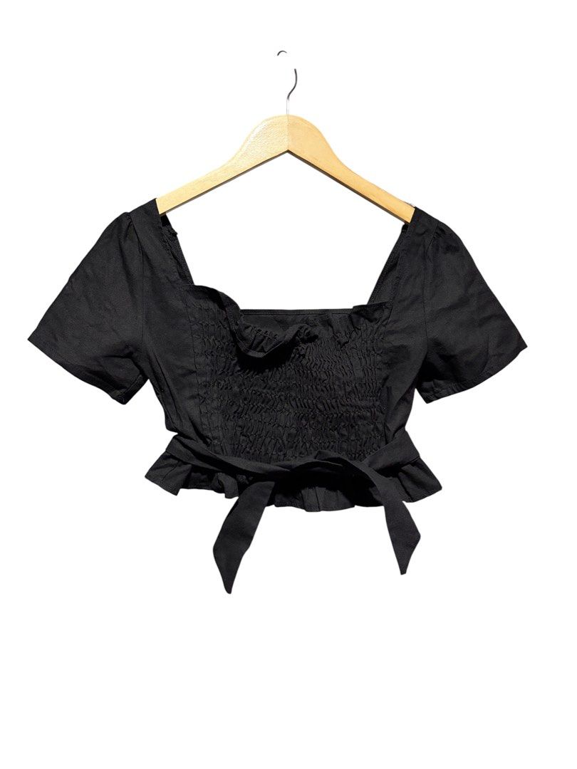 Black square neck crop top with tie front (Category: Blouses) located in Cavite. Submitted by grandearth.39df3f (Listing ID 1470150816, Image 2). Description: - Color: Black - Style: Crop top with short sleeves and square neckline - Fit: Stretchy smocked back panel for extra comfort - Details: Adjustable waist ties (front or back) and a cute ruffled hem - Condition: Worn a few times, still in solid shape - Pairing: Great with high-waisted jeans o
