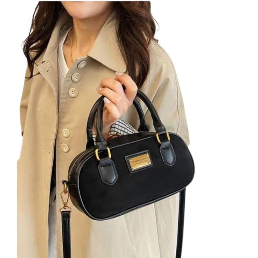 Black Suede Handbag Shoulder Bag (Category: Shoulder Bags) located in Mangaldan. Submitted by closetqwin (Listing ID 1470217909, Image 1). Description: - Color: Sleek black with a soft suede texture - Hardware: Premium gold-toned metal with a front branding plate Fashion Accessories Lady's Collection" - Versatility: Includes top handles and an adjustable/removable shoulder strap - See picture 9 for minimal flaws .