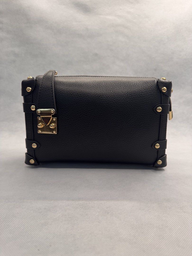 Black Trunk Crossbody Bag with Gold Hardware (Category: Purses & Pouches) located in Las Pinas. Submitted by uynice.ph (Listing ID 1470229047, Image 1). Description: 🖤 BLACK STUDDED TRUNK BAG A little edgy, a little classy! ✨ Featuring soft pebbled leather, gold-tone studded details, and a structured silhouette that elevates any outfit. 👈 Swipe left to see actual photos and details of the bag! 💰 Price: ₱5,000 🇮🇹 Origin: Made in Italy (as lab