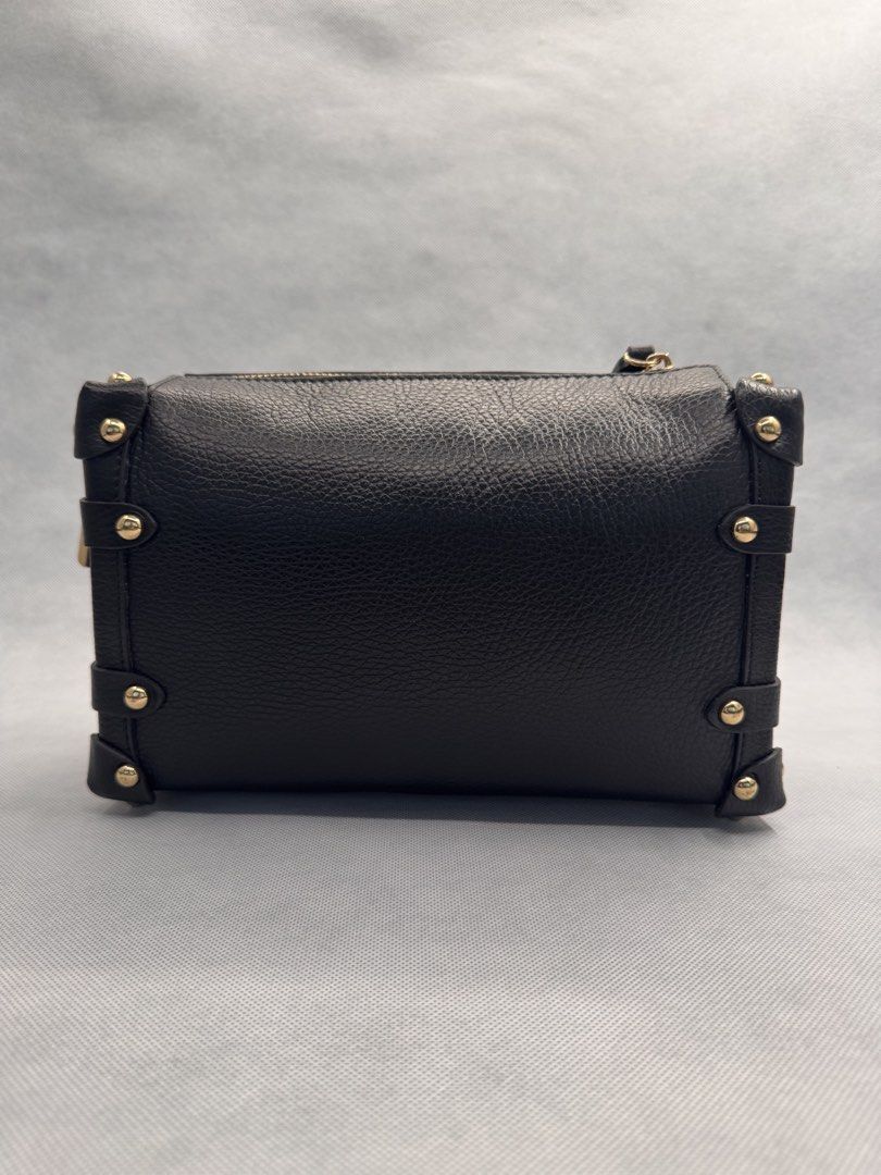 Black Trunk Crossbody Bag with Gold Hardware (Category: Purses & Pouches) located in Las Pinas. Submitted by uynice.ph (Listing ID 1470229047, Image 3). Description: 🖤 BLACK STUDDED TRUNK BAG A little edgy, a little classy! ✨ Featuring soft pebbled leather, gold-tone studded details, and a structured silhouette that elevates any outfit. 👈 Swipe left to see actual photos and details of the bag! 💰 Price: ₱5,000 🇮🇹 Origin: Made in Italy (as lab