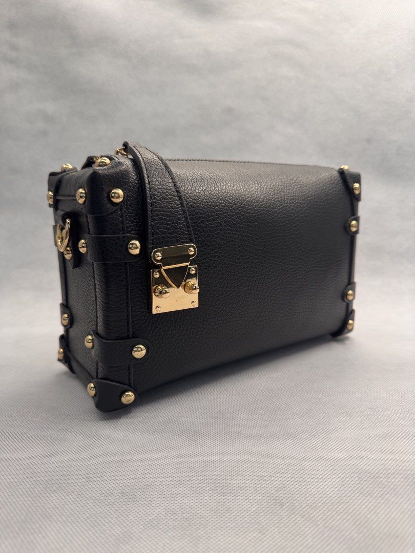 Black Trunk Crossbody Bag with Gold Hardware (Category: Purses & Pouches) located in Las Pinas. Submitted by uynice.ph (Listing ID 1470229047, Image 2). Description: 🖤 BLACK STUDDED TRUNK BAG A little edgy, a little classy! ✨ Featuring soft pebbled leather, gold-tone studded details, and a structured silhouette that elevates any outfit. 👈 Swipe left to see actual photos and details of the bag! 💰 Price: ₱5,000 🇮🇹 Origin: Made in Italy (as lab