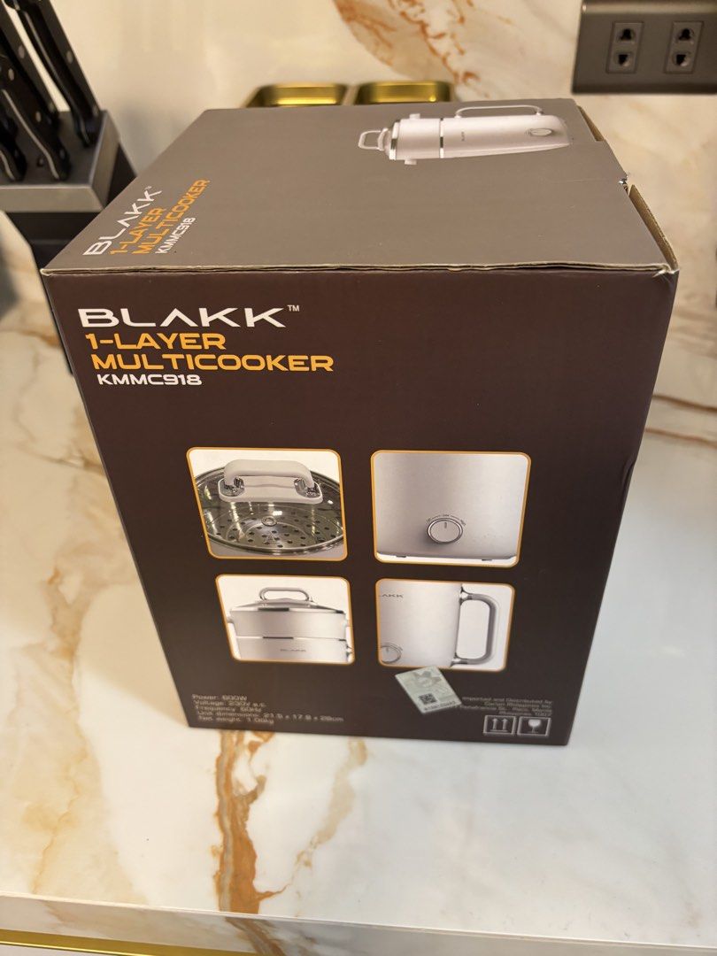 Blakk 1-Layer Multicooker KMMC918 (Category: Cookers) located in Paranaque City. Submitted by xavieraxb (Listing ID 1470170573, Image 3). Description: - Brand: Blakk - Model: KMMC918 - Capacity: 1.8L 1-layer multicooker with stainless steel inner body and steamer - Condition: Brand new/unused (taken out of box for photos only) - Safety Features: Cool touch outer layer and anti-slip feet - Power: 600W, 230V, 60Hz - Perfect for quick meals, condo l
